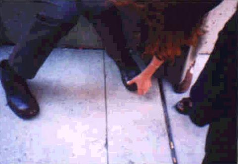 A fan sizing up Robert's feet.